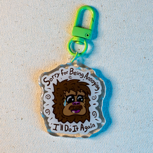 Keychain with Freddie the Yeti surrounded by the words "Sorry for Being Annoying, I'll Do It Again"