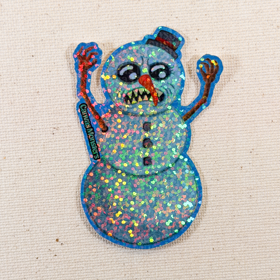 Colorful glittery snowman sticker with a top hat on a beige background