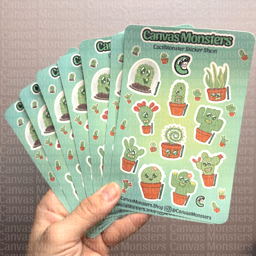 Hand holding a sheet of cactus-themed Canvas Monsters stickers.