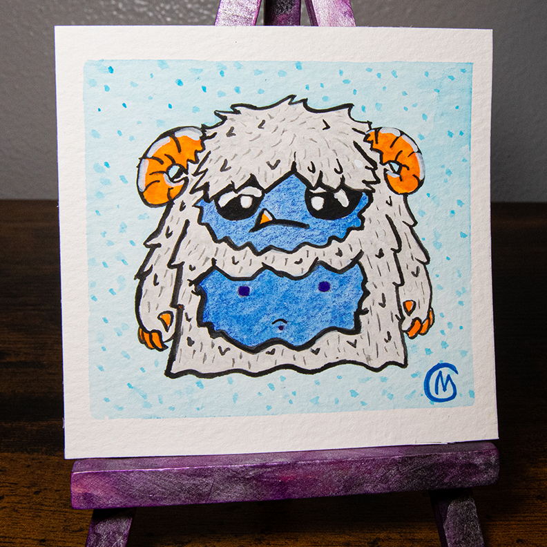 A watercolor painting of a yeti with blue and gray colors, framed in a purple and pink iridescent frame.