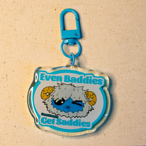 Keychain with Eddie the Yeti winking. Text reads "Even Baddies Get Saddies"