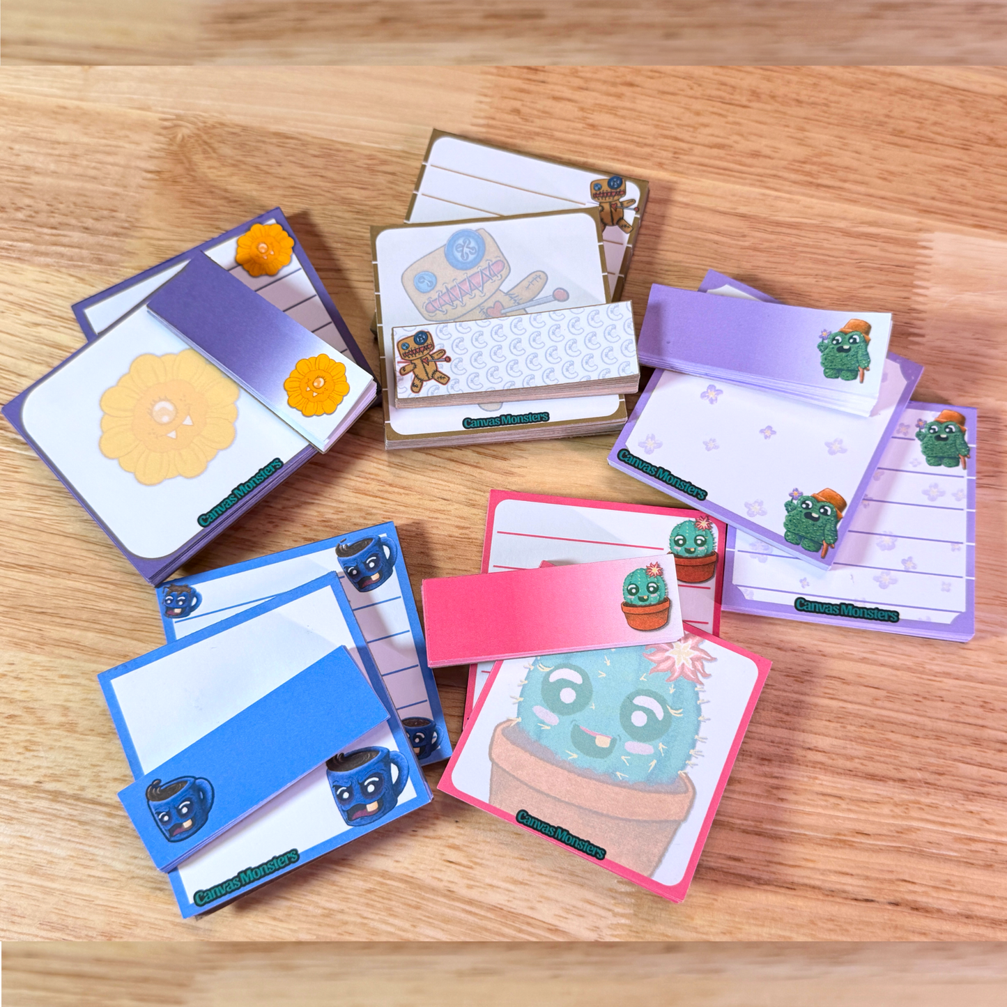 A full set of stationary, featuring five matching sets, all sitting on a wooden background.