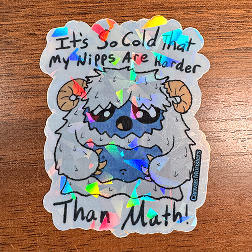 A sticker depicting a cartoon character resembling a yeti with a humorous text about it being so cold that the character's nipples are harder than math.