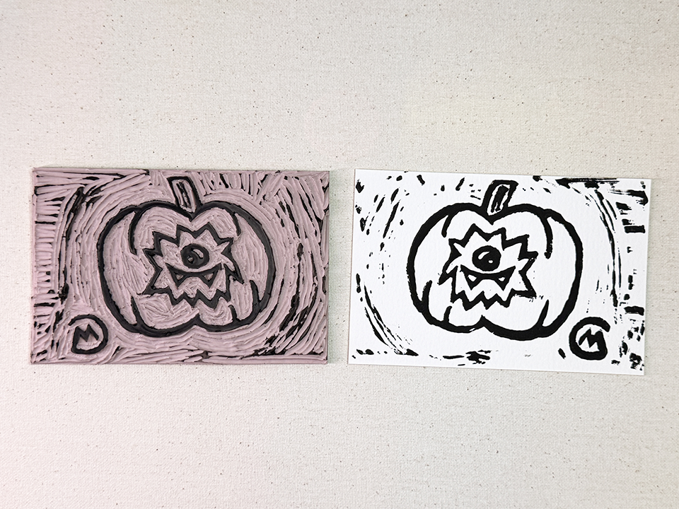 Punkin print stamp next to the stamped art on white paper