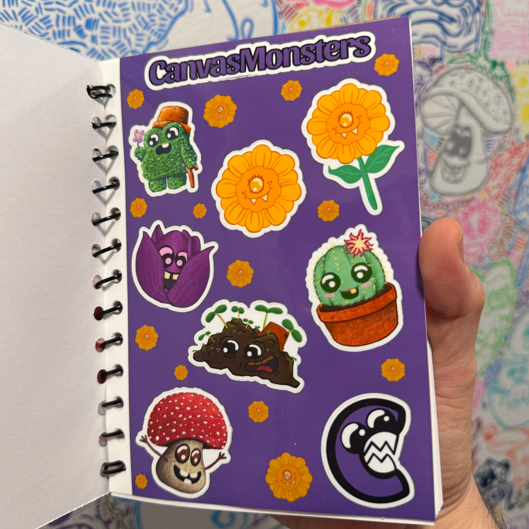 This is the sticker sheet inside a spiral-bound notebook featuring colorful cartoon plant and mushroom stickers on a purple cover. The notebook is photographed against a patterned fabric background.