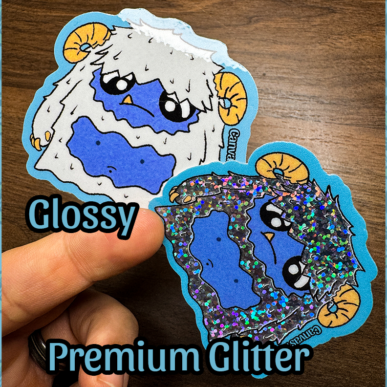An image of two stickers of a cartoon yeti with a blue and white color scheme, one sticker is a white and glossy variant. This top image has the text glossy under it. The other sticker is a glitter based fur yeti with blue accents. The bottom of this image has the text premium glitter written under.