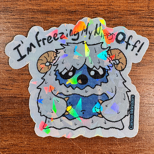 A sticker depicting a cartoon yeti character with the text 'I'm freezing my nips off!' The background is patterned with the same yeti character.