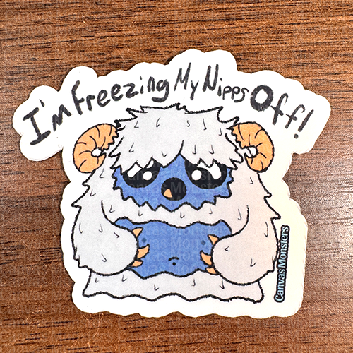 A sticker depicting a cartoon yeti character with the text 'I'm freezing my nips off!' The background is patterned with the same yeti character.