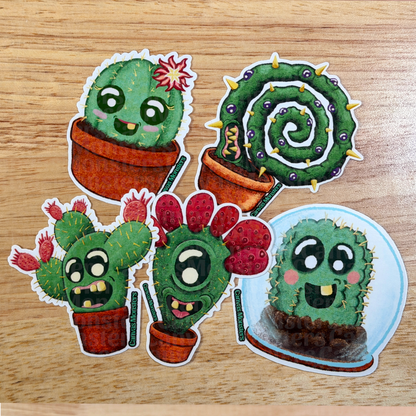 Set of cartoon cactus stickers on a wooden surface