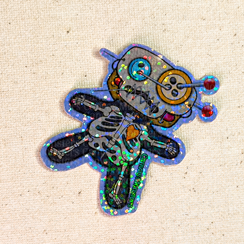 Glitter sticker of the character "Dawl" dressed in a skeleton costume