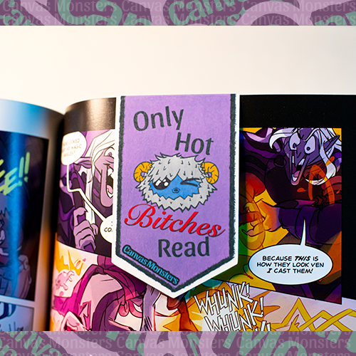 Magnetic bookmark pictured in a graphic novel. The bookmark is purple with Canvas Monsters character Eddie the Yeti winking. The phrase on the bookmark says "Only Hot Bitches Read"