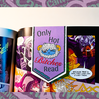 Magnetic bookmark pictured in a graphic novel. The bookmark is purple with Canvas Monsters character Eddie the Yeti winking. The phrase on the bookmark says "Only Hot Bitches Read"