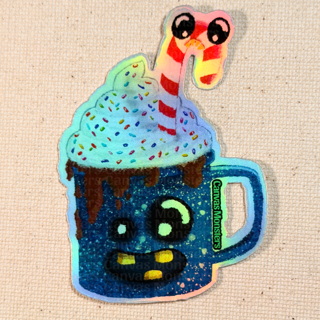 Holofoil sticker of a cartoonish camping mug with a face, filled with whipped cream and a candy cane on a textured beige background