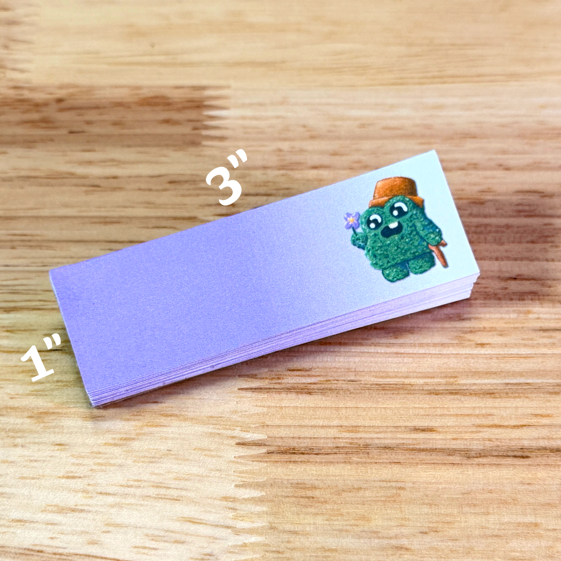 1x3 inch sticky notepad with purple paper and a shrub cartoon character on the right side.