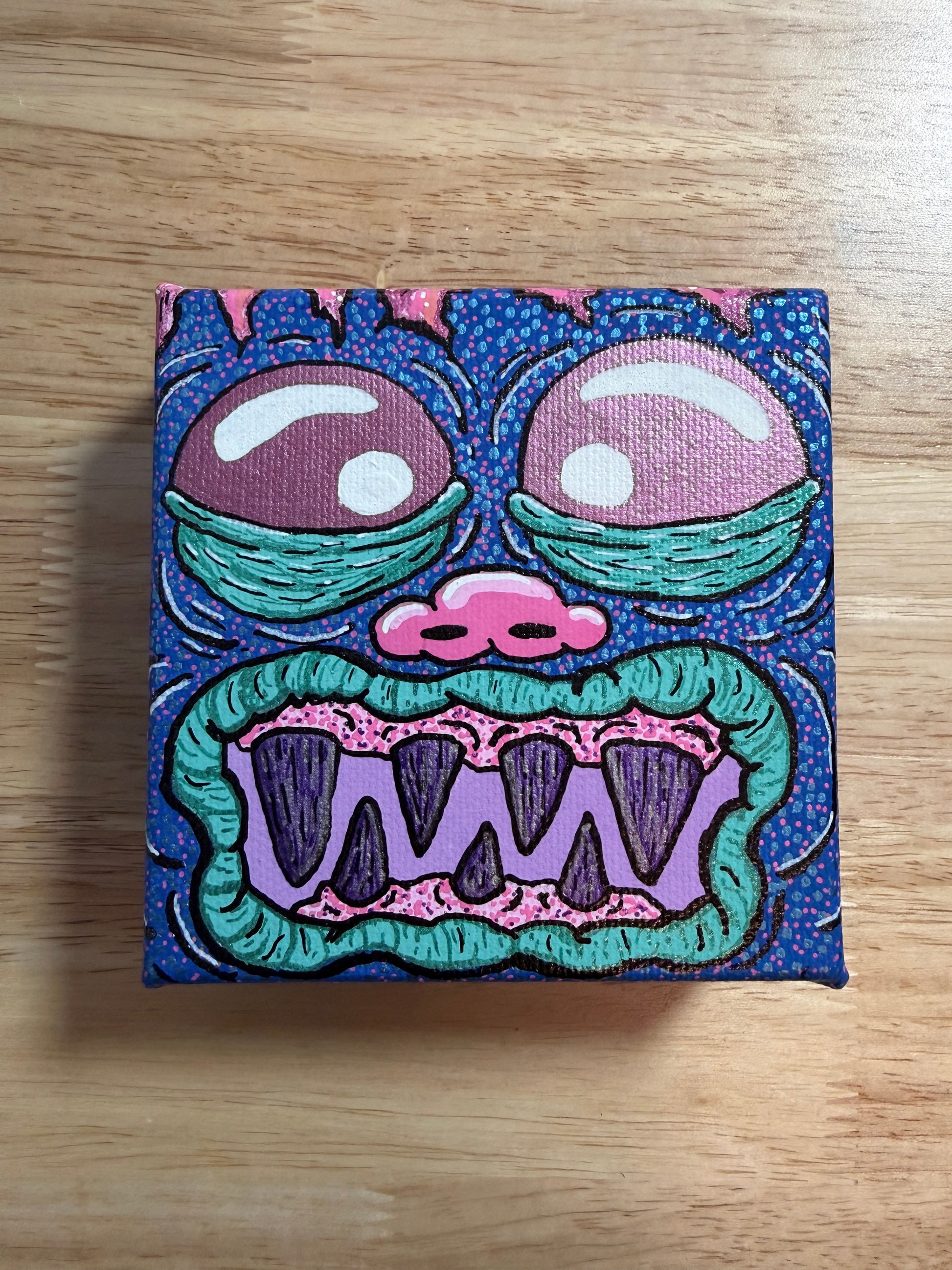 Colorful abstract painting on a wooden surface