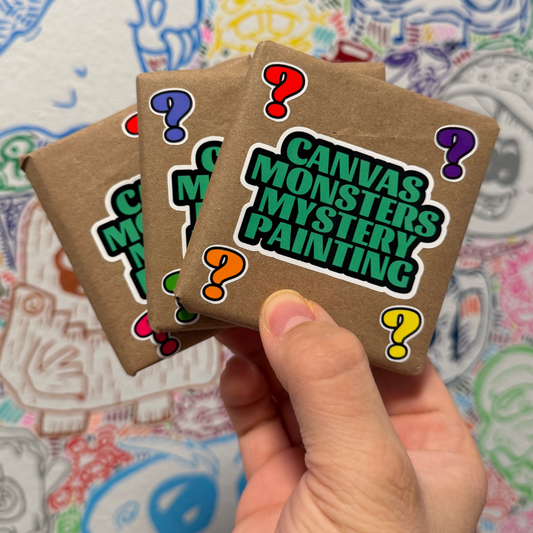 A hand holds three small brown paper envelopes with colorful question marks and the text 'CANVAS MONSTERS MYSTERY PAINTING' featuring a question mark patterned surface.