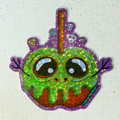 Glitter sticker of an apple-shaped character with green poisin and purple border on a textured background