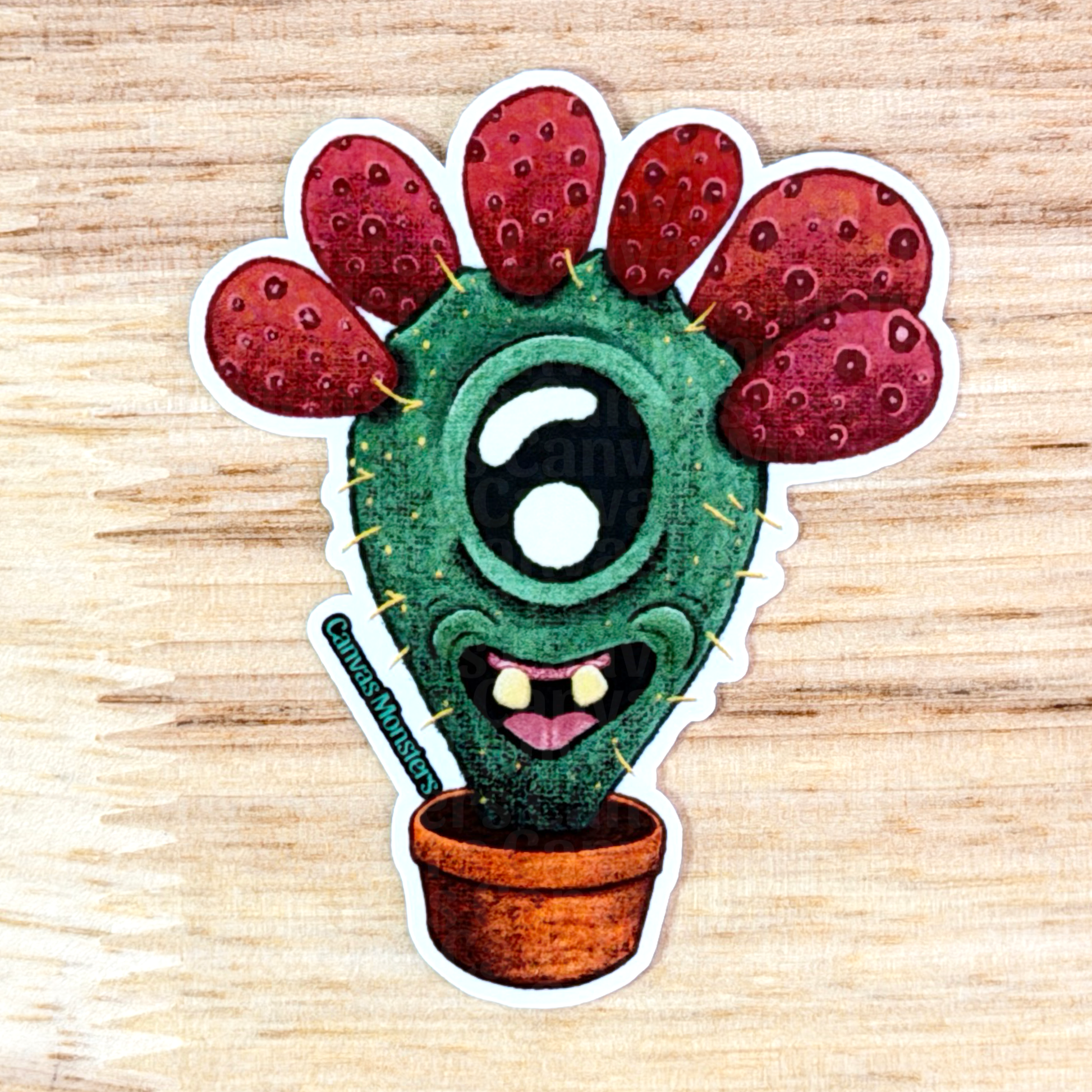 Cartoon cactus with red flowers on a wooden surface