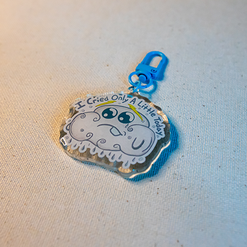 Keychain with Nimby the cloud raining and the words "I Cried Only A Little Today"