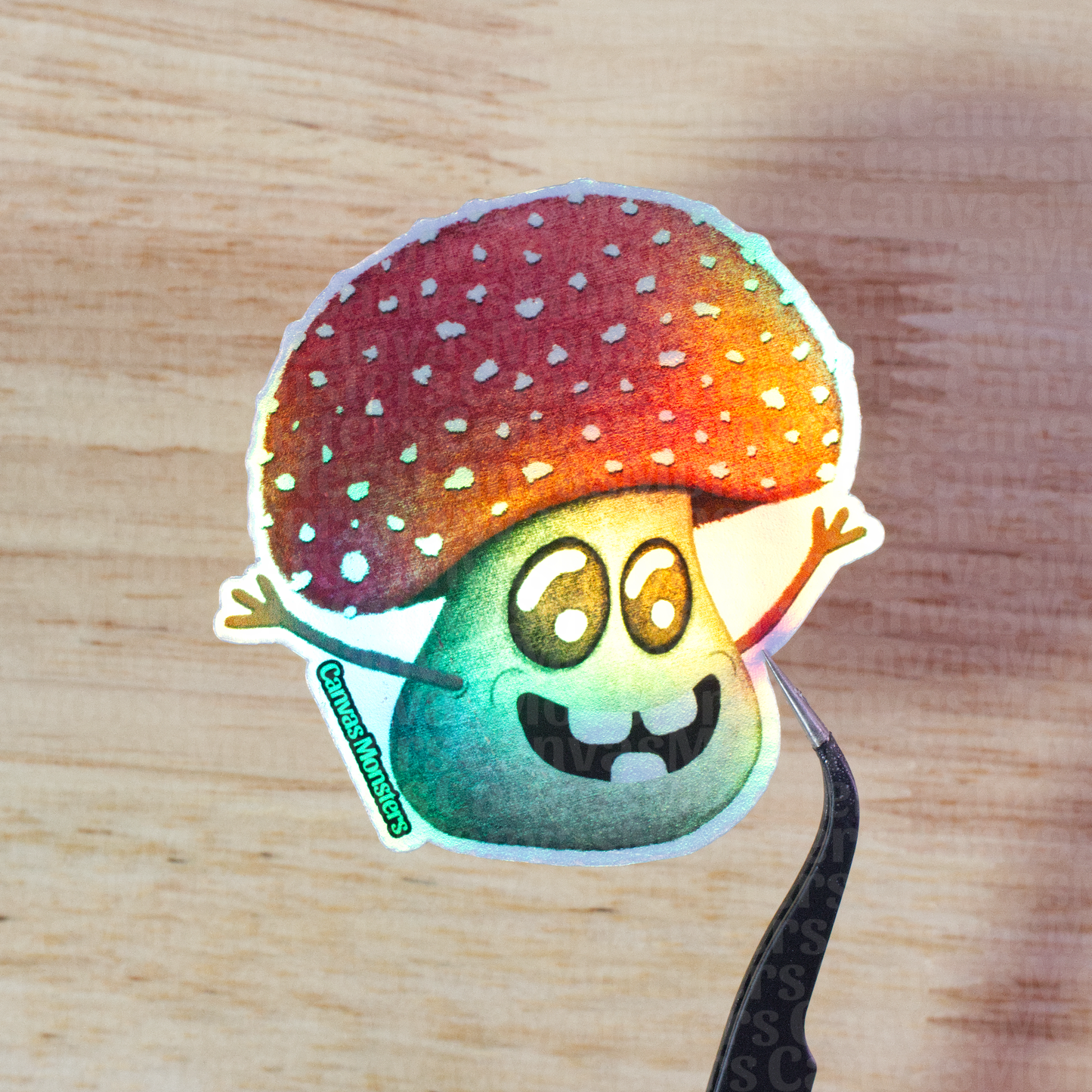 Holofoil sticker of a cartoon mushroom held above a wooden surface