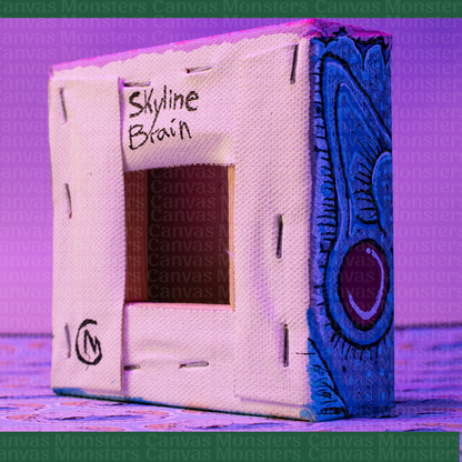 The back of a canvas, featuring a signature and text of the name of the piece. with 'Skyline Brain' text on a textured surface.