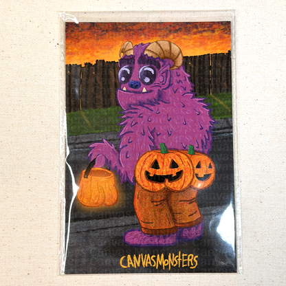 Halloween-themed art print with a purple monster holding pumpkins, on a textured beige background.