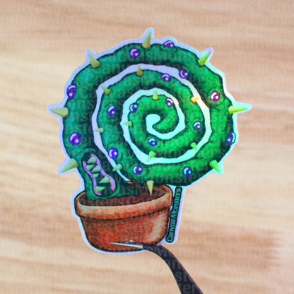 Holofoil sticker of a spiral cactus character on a wooden background