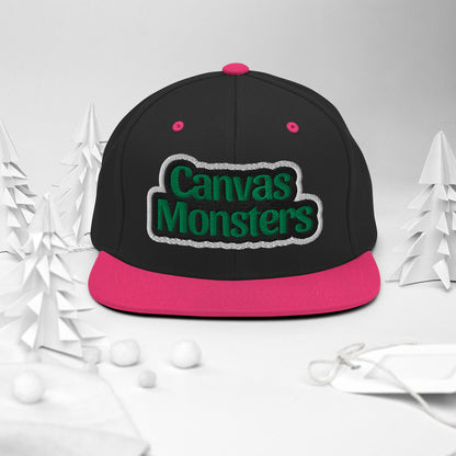 Black and pink cap with 'Canvas Monsters' text on a white background