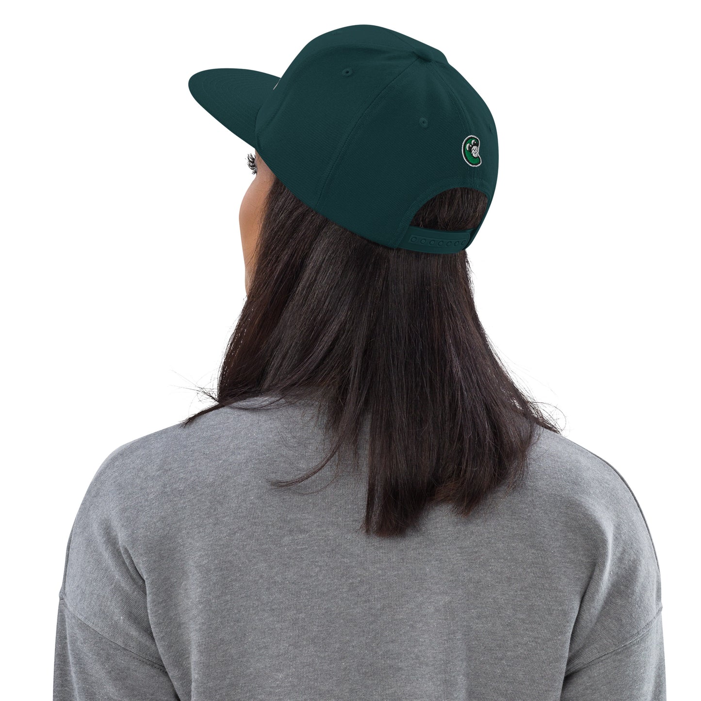 Person wearing a green cap with a logo on a white background