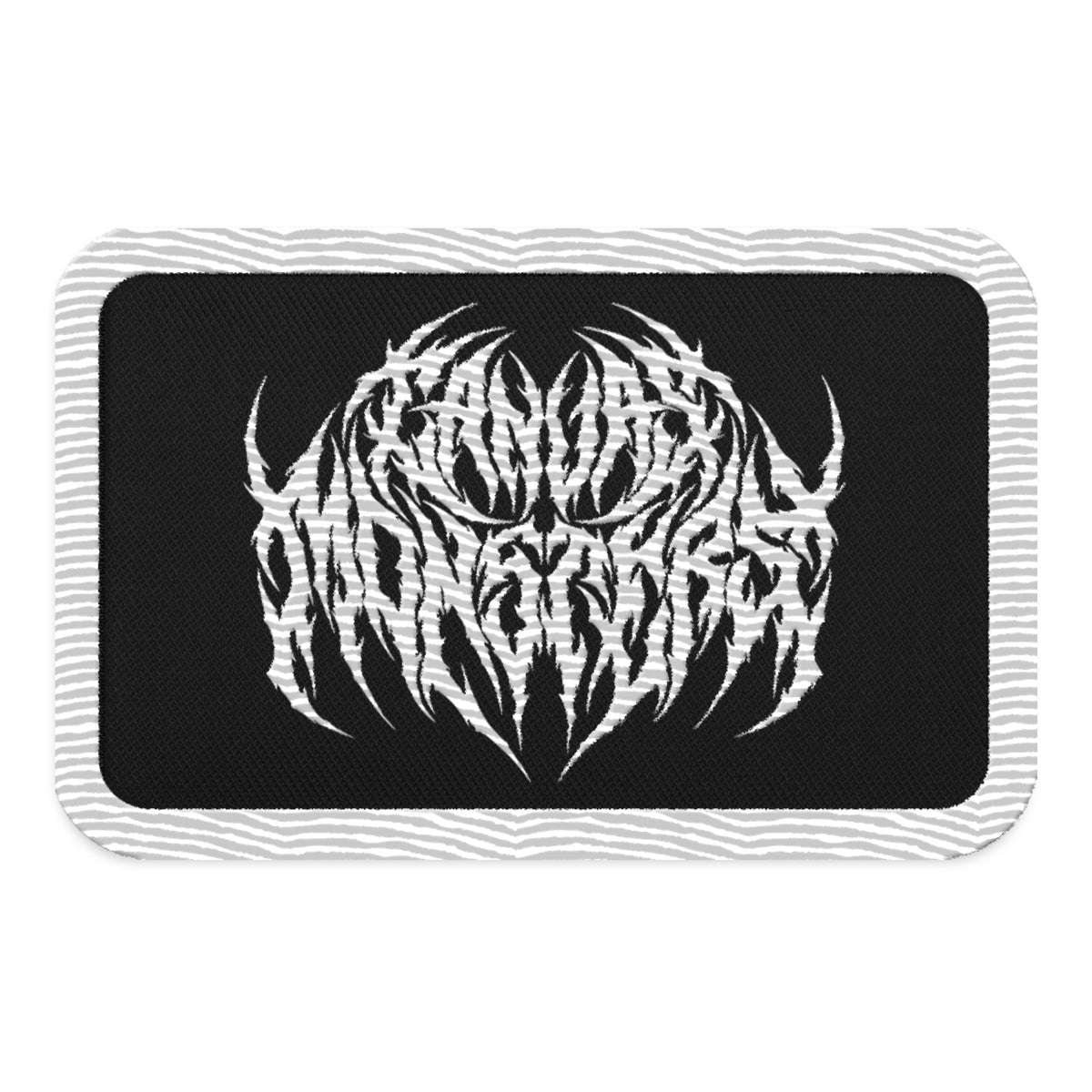 Embroidered patch with a white outline, black background and white embroidered design in metal lettering that reads "Canvas Monsters", all on a white background.