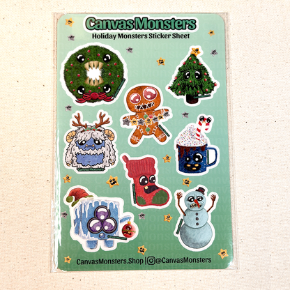 Sheet of holiday-themed monster stickers by Canvas Monsters on a beige background