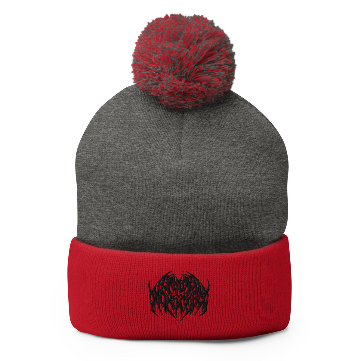 Image of a knit beanie with a pom pom on top, in red and gray with a metal text logo on the front.