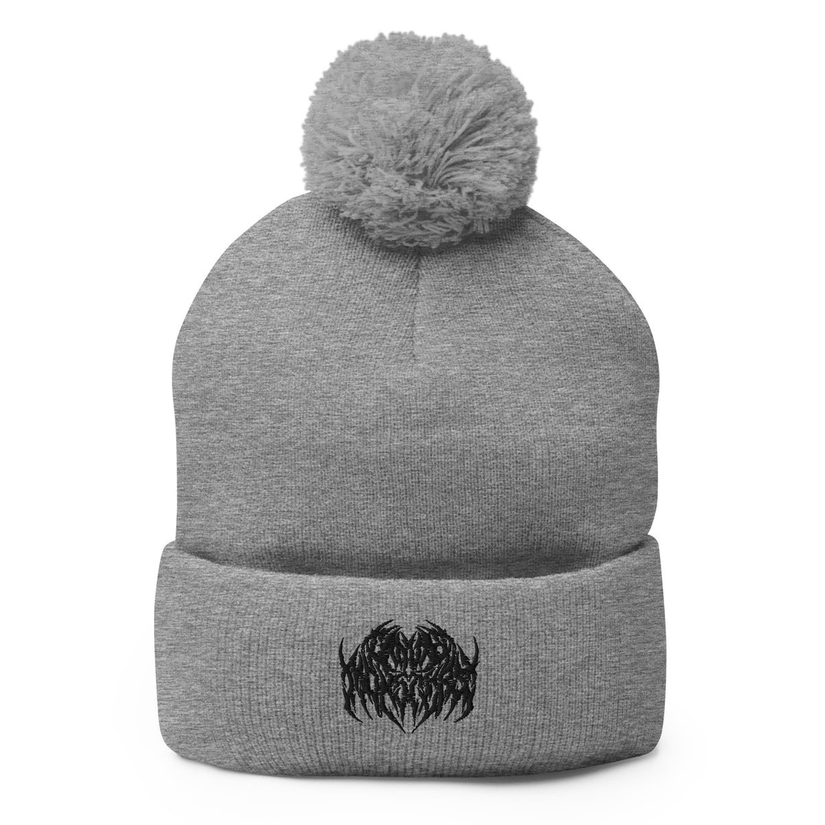 Image of a knit beanie with a pom pom on top, in heather gray with a metal text logo on the front.