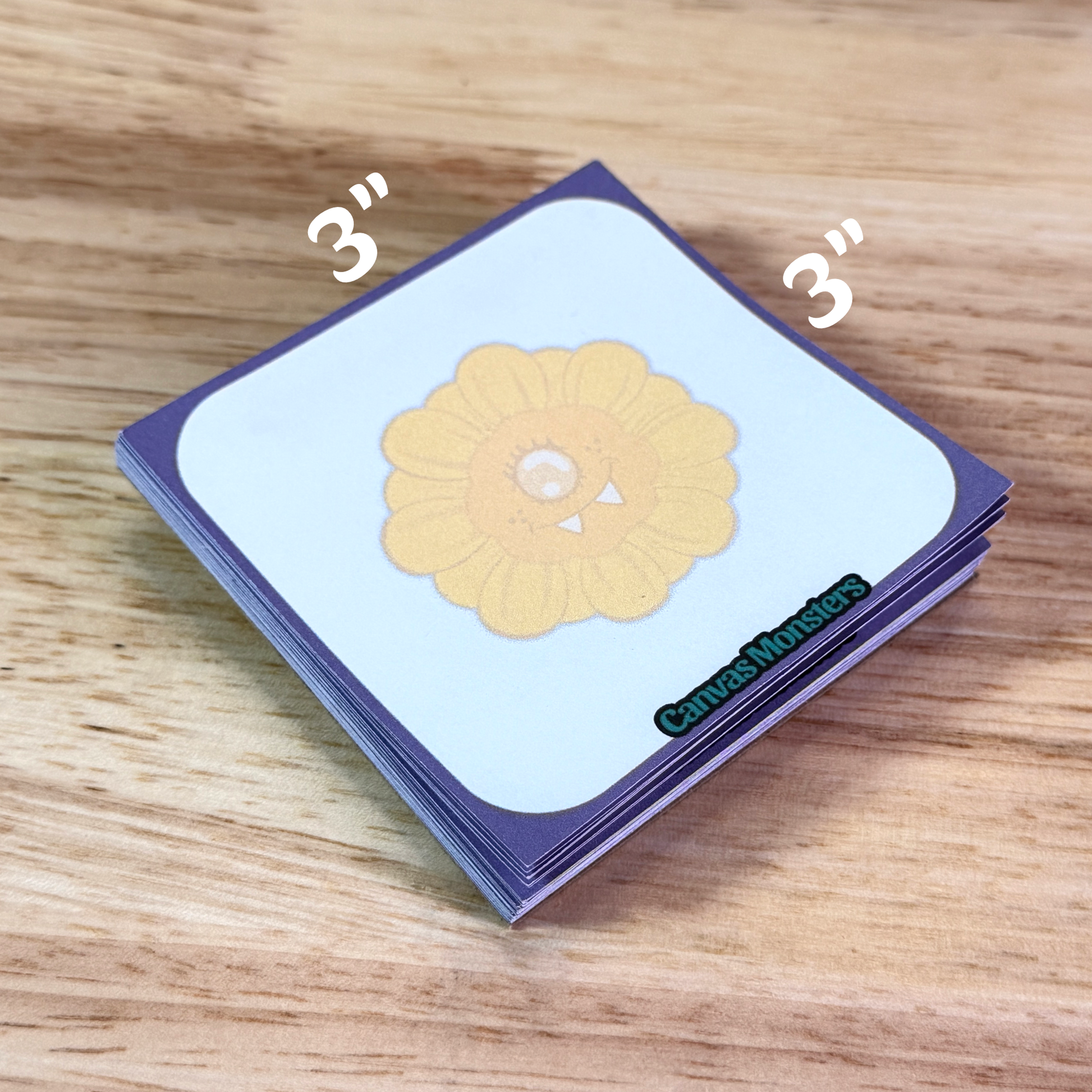 3x3 inch sticky note pad with a purple border and a cartoon sunflower in the center