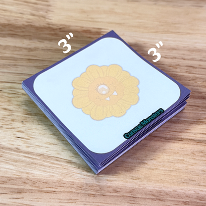 3x3 inch sticky note pad with a purple border and a cartoon sunflower in the center
