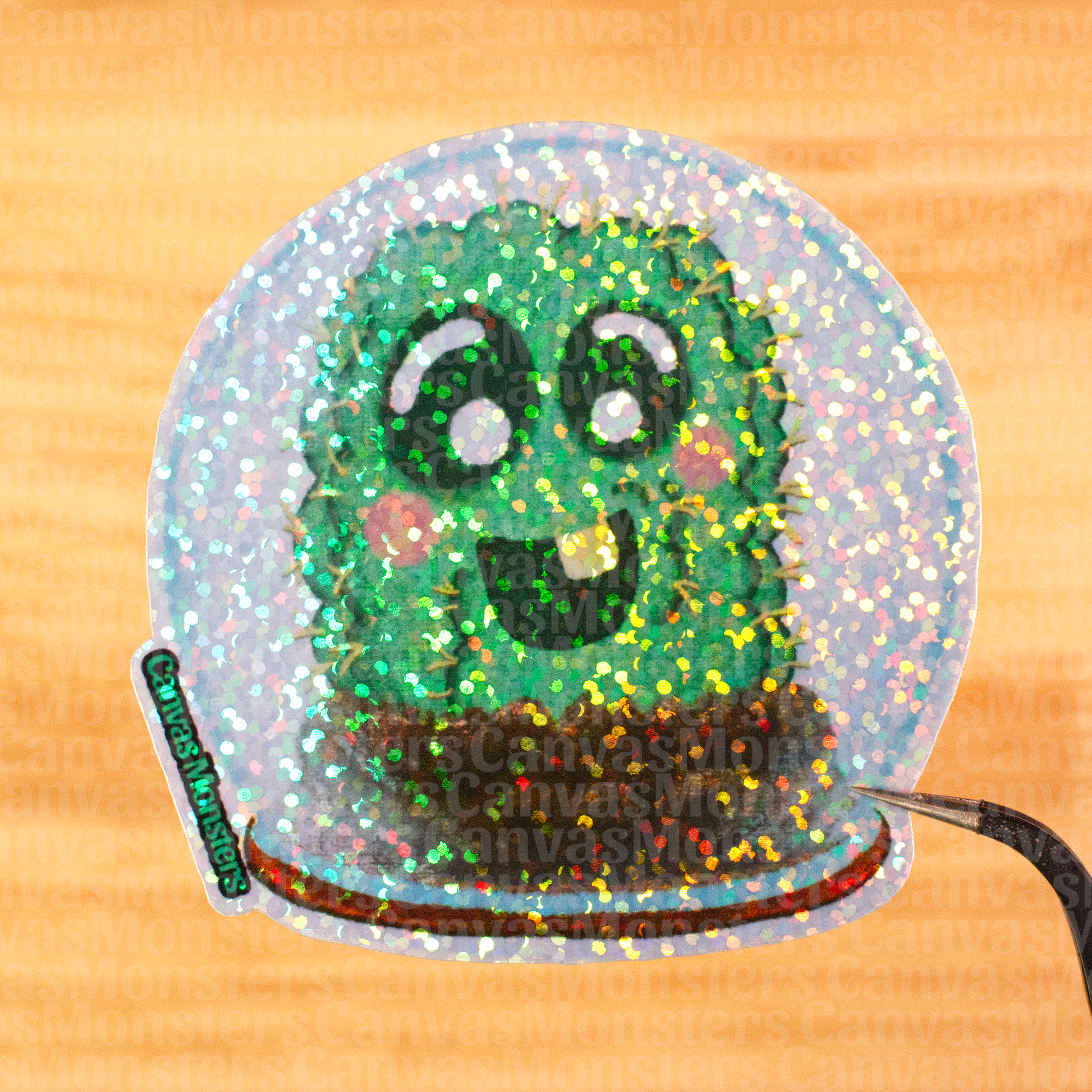 Glitter sticker of a cartoon cactus in a terrarium with a happy expression on a wooden surface